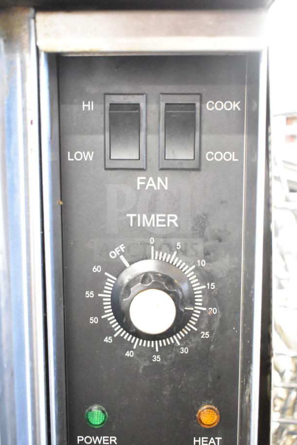 Seagate commercial convection ovens control panel with fan switches, timer dial, power, and heat indicators.