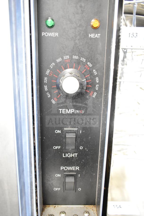 Two Seagate full-size convection ovens with thermostatic controls, view windows, and commercial casters. Power and heat settings visible.