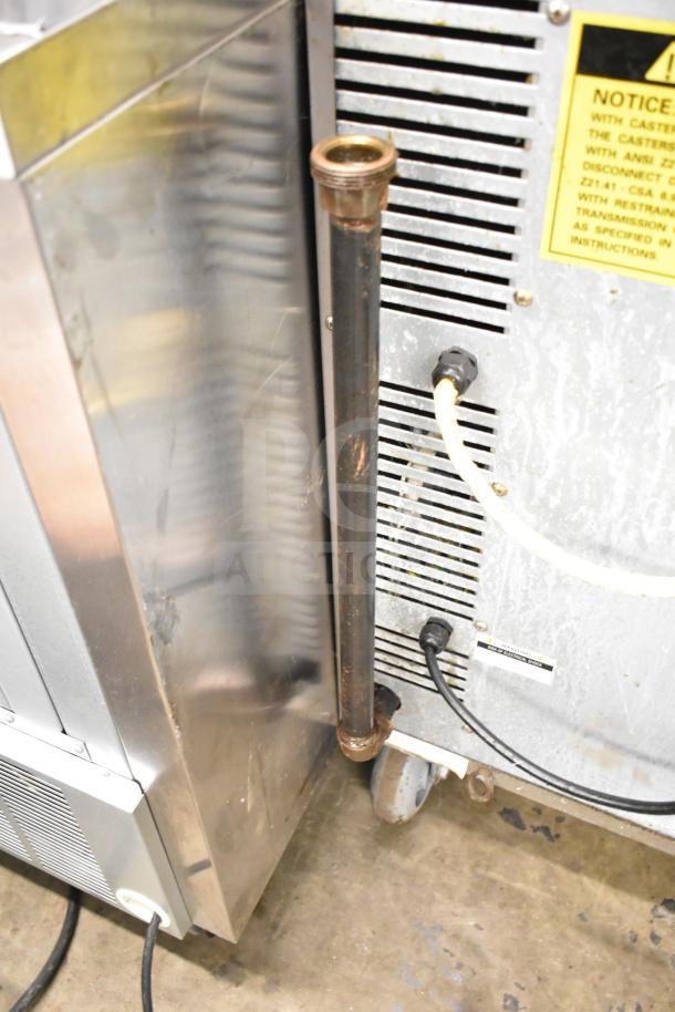 2 Seagate full-size convection ovens on commercial casters; feature view-through doors and thermostatic controls.