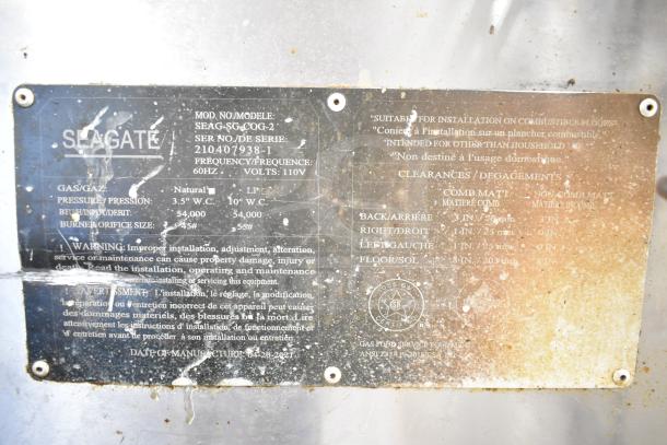 Seagate convection oven model SEAG-SG-COG-2, gas-powered, 110V, on commercial casters, visible wear on label.
