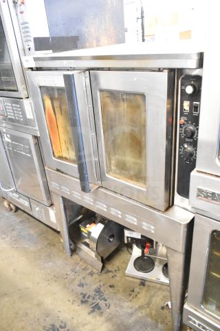 Blodgett DFS-100 commercial convection oven with viewing doors, thermostatic controls on metal legs. Signs of use present.
