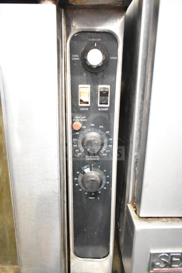 Blodgett DFS-100 convection oven with view-through doors, thermostatic controls, visible wear. Model controls shown.