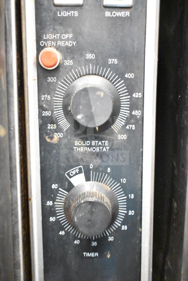 Blodgett DFS-100 convection oven control panel with solid state thermostat and timer, showing temperature and timer settings.