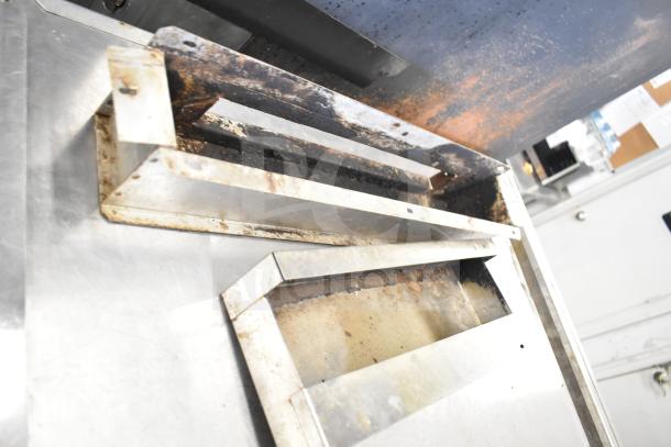 Blodgett DFS-100 convection oven, with view through doors, thermostatic controls, and metal legs; visible wear and discoloration.