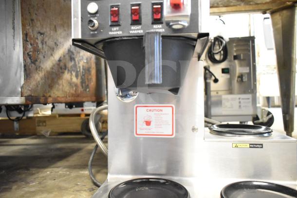 Bloomfield 8572 commercial 3 burner coffee machine with hot water dispenser. 120 volts, caution labels visible, stainless steel.