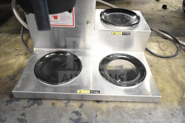 Bloomfield 8572 commercial coffee machine with 3 burners and hot water dispenser. Stainless steel, 120V, visible caution labels.