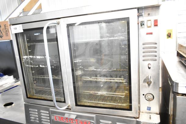 Blodgett commercial gas convection oven, full-size, dual model, glass doors, stainless steel, visible wear, control panel shown.