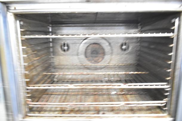 Blodgett commercial gas convection oven interior, full size, multiple racks, stainless steel, used condition.