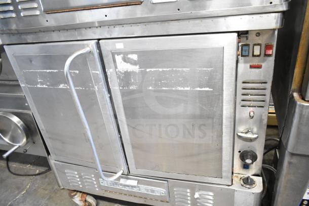 Blodgett commercial gas convection oven, stainless steel, full-size, visible controls, moderate wear, branded logo.