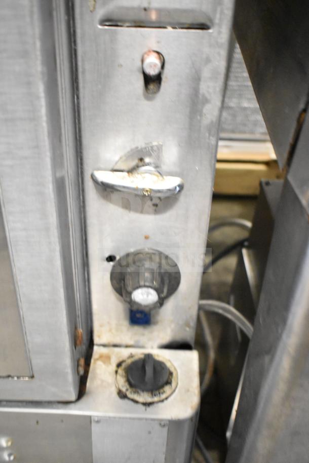 Blodgett commercial gas convection oven controls, showing knobs and wear. Ideal for professional kitchens.