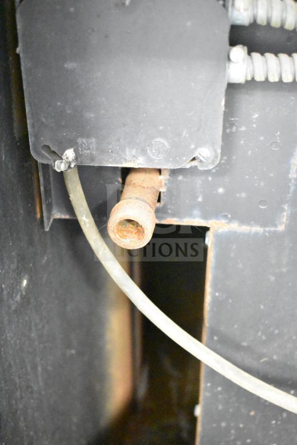 Blodgett commercial gas convection oven connector detail, showing metal housing and hose attachment.