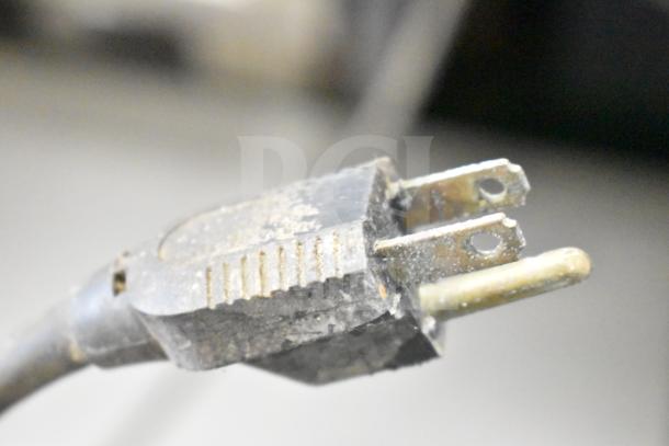 Image of a worn electrical plug, possibly part of a Blodgett commercial gas convection oven, showing signs of age.