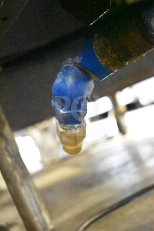 Cleveland Commercial 30 Gallon Braising Pan; close-up of plumbing connection detail; used condition.