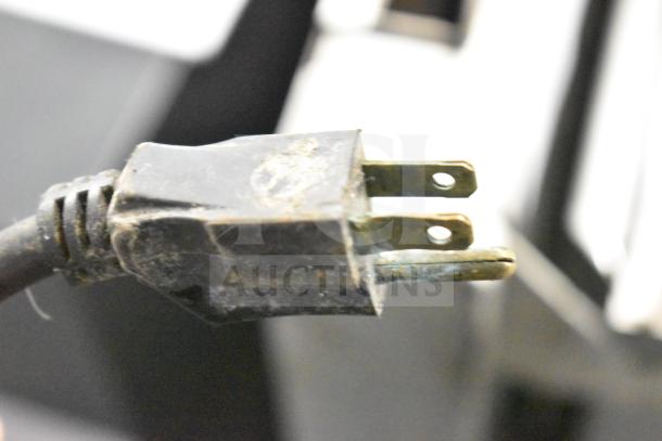 Cleveland Commercial 30 Gallon Braising Pan, close-up of power plug, shows signs of wear, suitable for heavy-duty cooking.