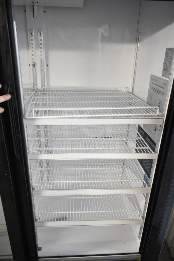 Dukers DSM-68SR commercial three-door cooler with adjustable shelves, model label visible, 115V, 1 phase, clean condition.