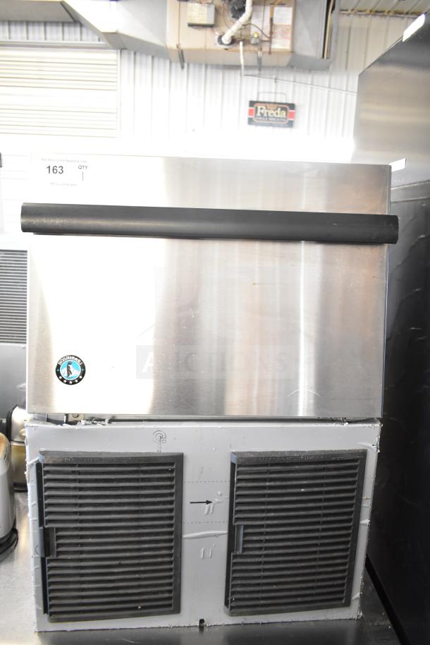 Hoshizaki Commercial Undercounter Ice Machine, stainless steel, self-contained, 115V, visible vents, good condition.