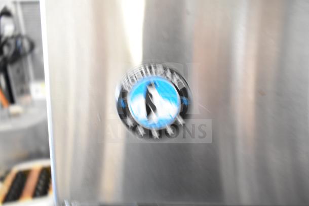 Hoshizaki commercial undercounter ice machine, stainless steel, 115 volts, self-contained, brand logo visible.