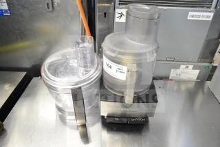 Cuisinart countertop food processor with two bowls, one S blade, 115 volts, 1 phase. Condition: appears used. Model details on base.