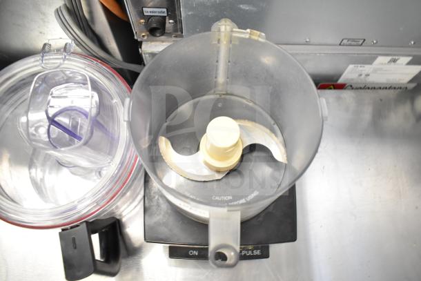 Cuisinart countertop food processor with two bowls and S blade. Black base, used condition. 115 volts, 1 phase.