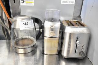 Three kitchen appliances: Black & Decker 2-slot toaster, Chefman hot water pitcher, Krups GVX212/6W0 grinder, used condition.
