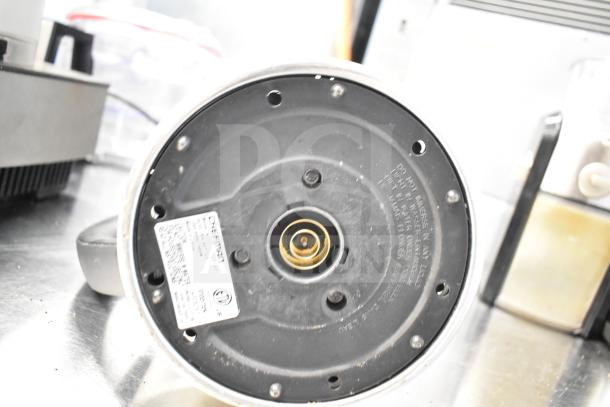 Black & Decker 2-slot toaster, Chefman hot water pitcher with visible label, Krups GVX212/6W0 grinder; all in used condition.