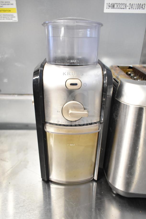 Krups GVX212/6W0 Grinder with dial control, visible wear. Includes Chefman Hot Water Pitcher and Black & Decker 2 Slot Toaster.