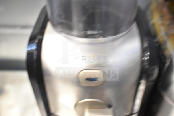 Three appliances: Black & Decker toaster, Chefman hot water pitcher, Krups GVX212 grinder. Appears in used condition.