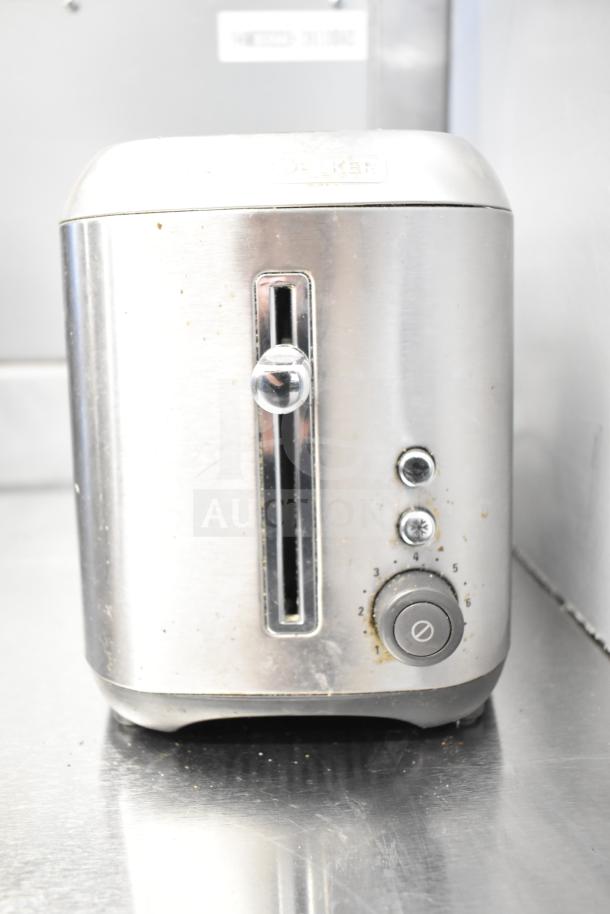 Black & Decker 2-slot toaster with adjustable settings, visible controls, and signs of use. Auction includes 3 items.