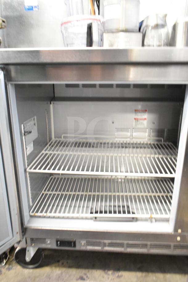 Beverage Air WTR60AHC commercial cooler, two-door, on casters, 115 volts, 1 phase, interior view with shelves, used condition.