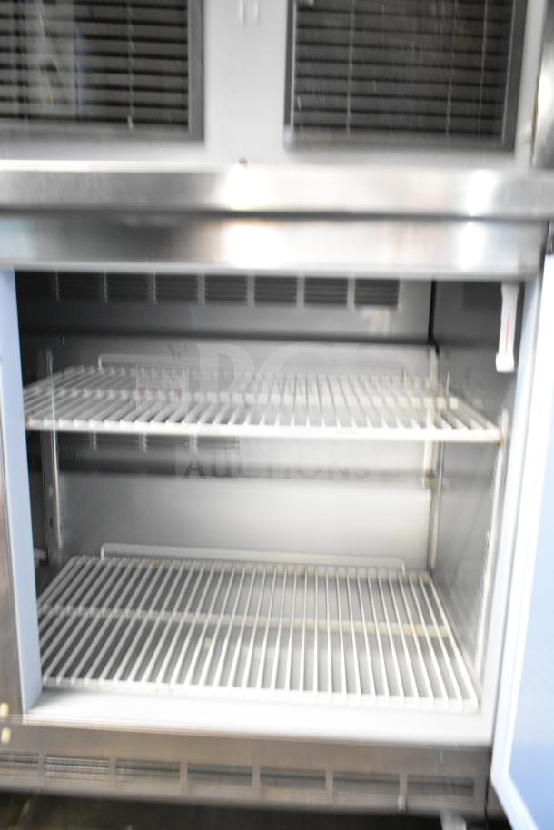 Beverage Air WTR60AHC 2-door commercial reach-in cooler on casters. 115 volts, 1 phase. Metal shelving, clean interior.