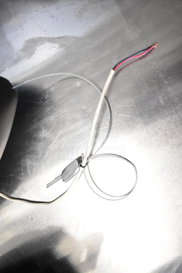 Bundle of audio equipment with visible cables and a label marked "STRIPPLE"; includes QSC AD-S6T and Crestron speakers.