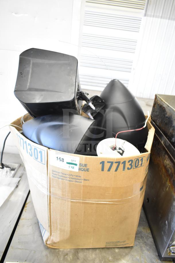 Cardboard box containing various items, including QSC AD-S6T and Crestron speakers. Box labeled for auction, item 168.