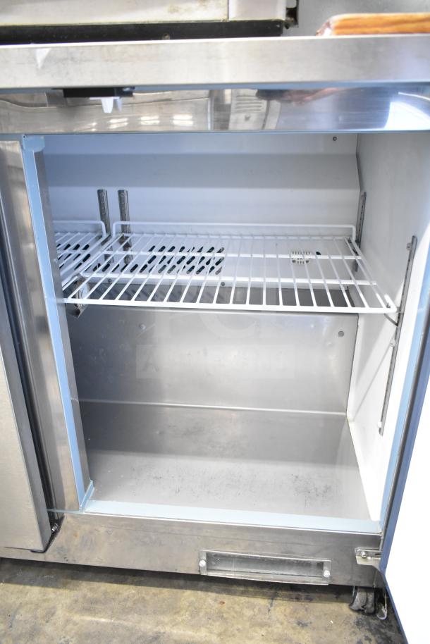 Motak MUF-72 Commercial 3 Door Undercounter Freezer, 115 Volts, 1 Phase, stainless steel, interior view showing shelves.