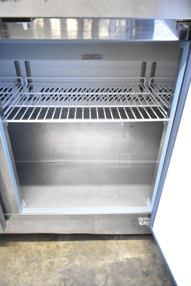 Motak MUF-72 commercial 3-door undercounter freezer, stainless steel, 115V, 1 phase, visible shelving, clean interior.