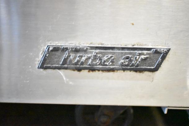 Turbo Air TST-48SD-18 prep table, stainless steel, used condition, visible logo, 115 volts, 1 phase, commercial use.