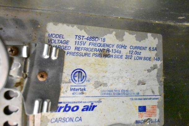 Turbo Air TST-48SD-18 Prep Table label showing model details, 115V power, refrigerant type, and certification marks.
