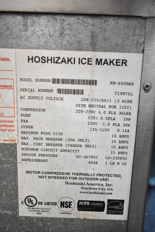 Hoshizaki KM-650MAH commercial ice machine head with label details, including model, serial number C19875L, voltage 208-230V.