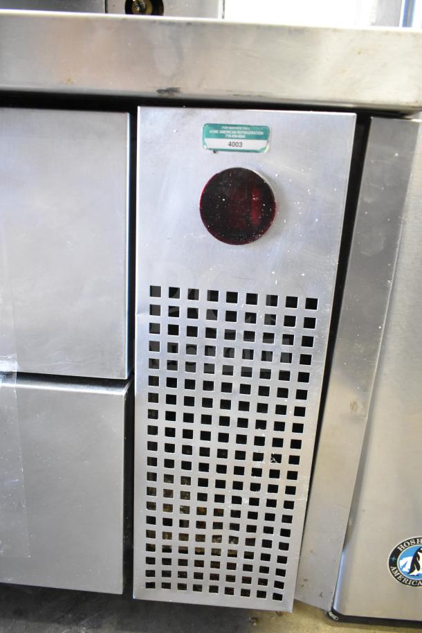 True TRCB-72 commercial chef base with 4 drawers, on casters. Stainless steel, 115V, 1 phase. Visible service label.