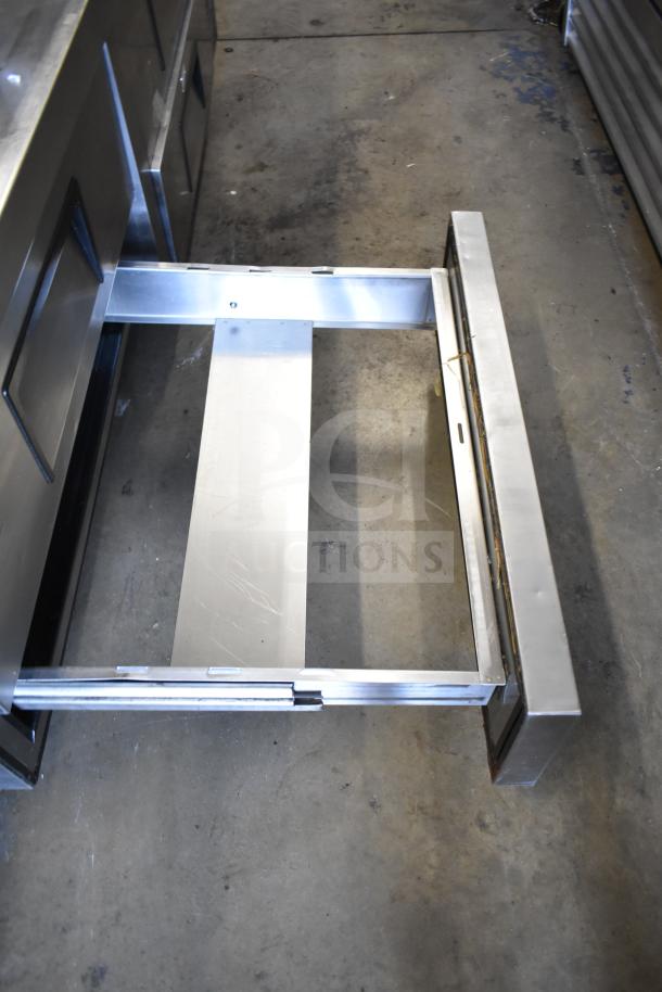 True TRCB-72 commercial chef base, 4 stainless drawers, on casters, 115V, 1 phase. Visible drawer detail, good condition.