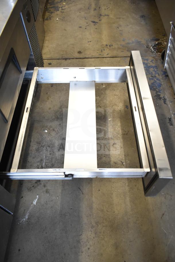 True TRCB-72 commercial chef base with four drawers, shown on casters. Stainless steel construction, open drawer visible. 115V, 1 phase.