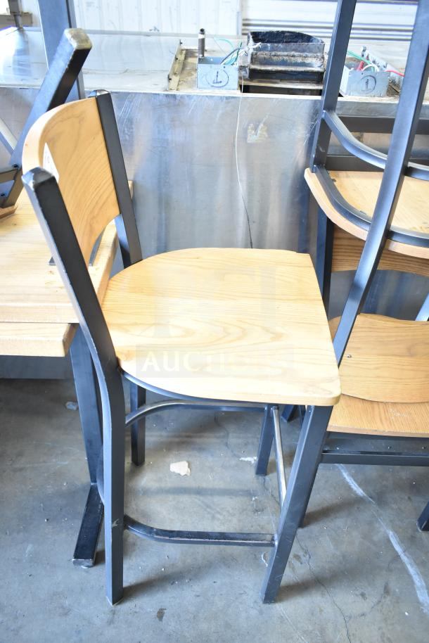 8 wood-pattern chairs with metal frames. Bar and dining height, good condition. Durable design; bid for a set of 8.