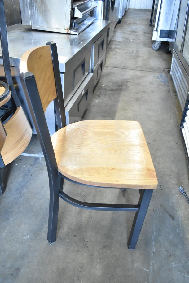8 wood pattern dining and bar height chairs on black metal frames, used condition, natural wood finish.