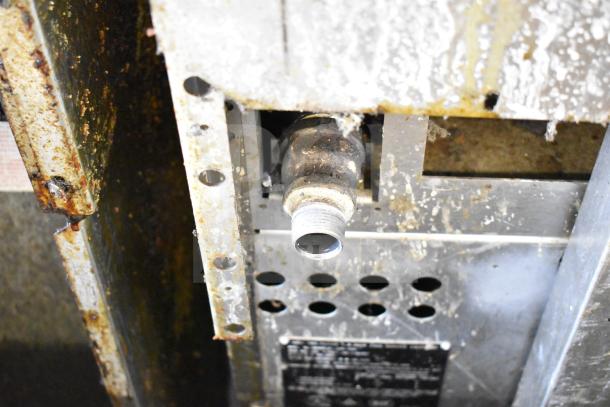 Vulcan 36S-6BN commercial 6 burner gas range underside, showing gas connector and wear. Suitable for heavy-duty use.