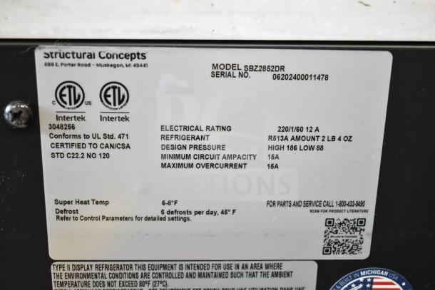 Structural Concepts SBZ2852DR display case label, showing model, serial number, electrical rating, and refrigerant details.