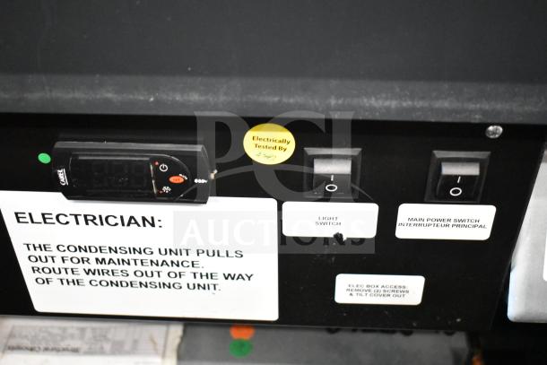 Structural Concepts SBZ2852DR display case control panel with power and light switches. "Electrically Tested" sticker visible.