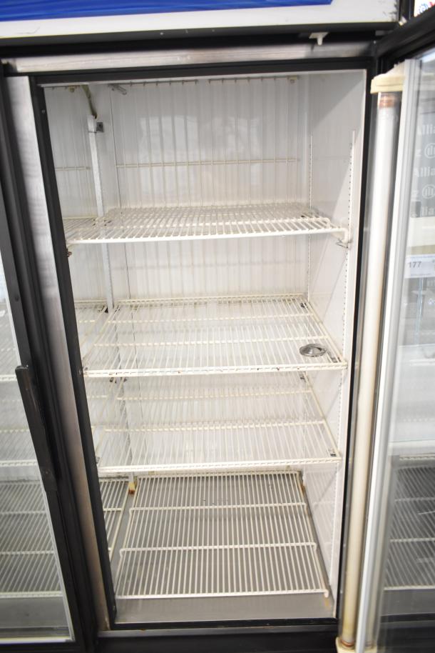 True GDM-49F commercial two-door reach-in freezer merchandiser with adjustable wire shelves, 115/208-230 volts, 1 phase.