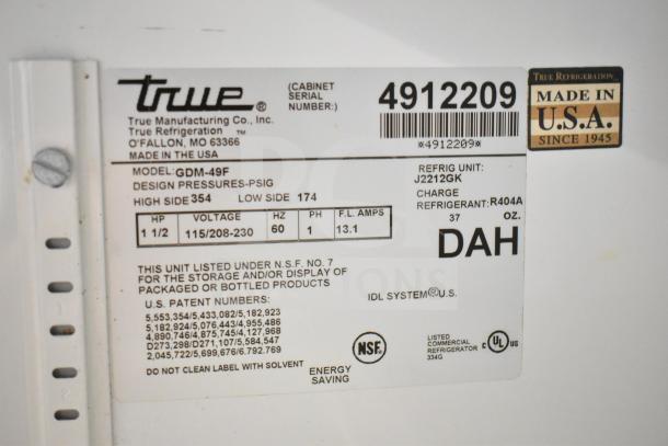 True GDM-49F Commercial Freezer label. Voltage: 115/208-230V, 1 Phase. NSF certified. Made in USA. Model and specs listed.