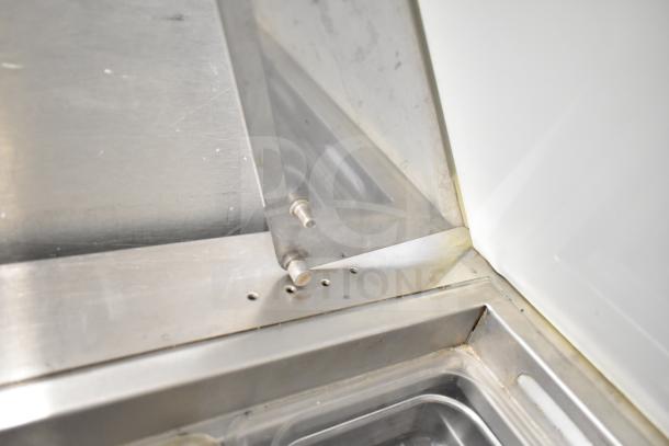 Everest EPBR2 Commercial Sandwich Salad Prep Table, stainless steel, showing a corner section with mounting screws.