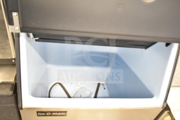 Scotsman C0630SA-32A ice head on Ice-O-Matic B55PS bin, 208/230V, 1-phase, open bin showing interior space.