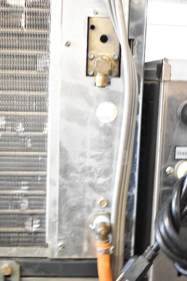 Scotsman C0630SA-32A ice head on Ice-O-Matic B55PS bin, 208/230V, 1 phase, showing rear panel with connections.